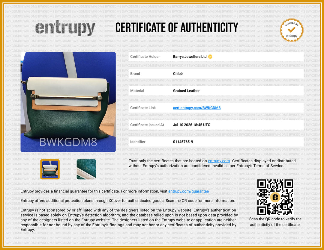 A certificate of authenticity document for Barrys Jewellers Ltd, featuring a blue and black leather roller tool, a small leather sample swatch, and a QR code on a white and gold background. The brand 'Entrupy' is clearly visible at the top.