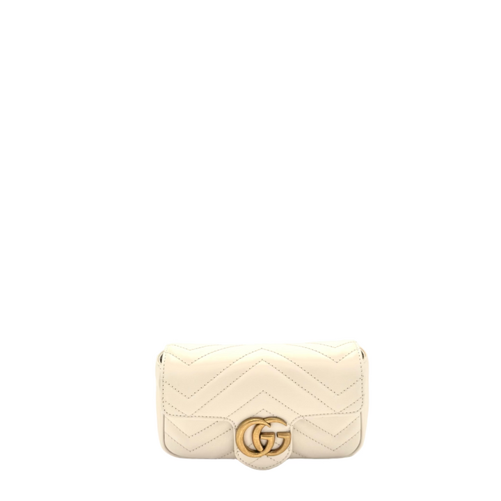 Gucci cream quilted handbag with a gold logo on a white background