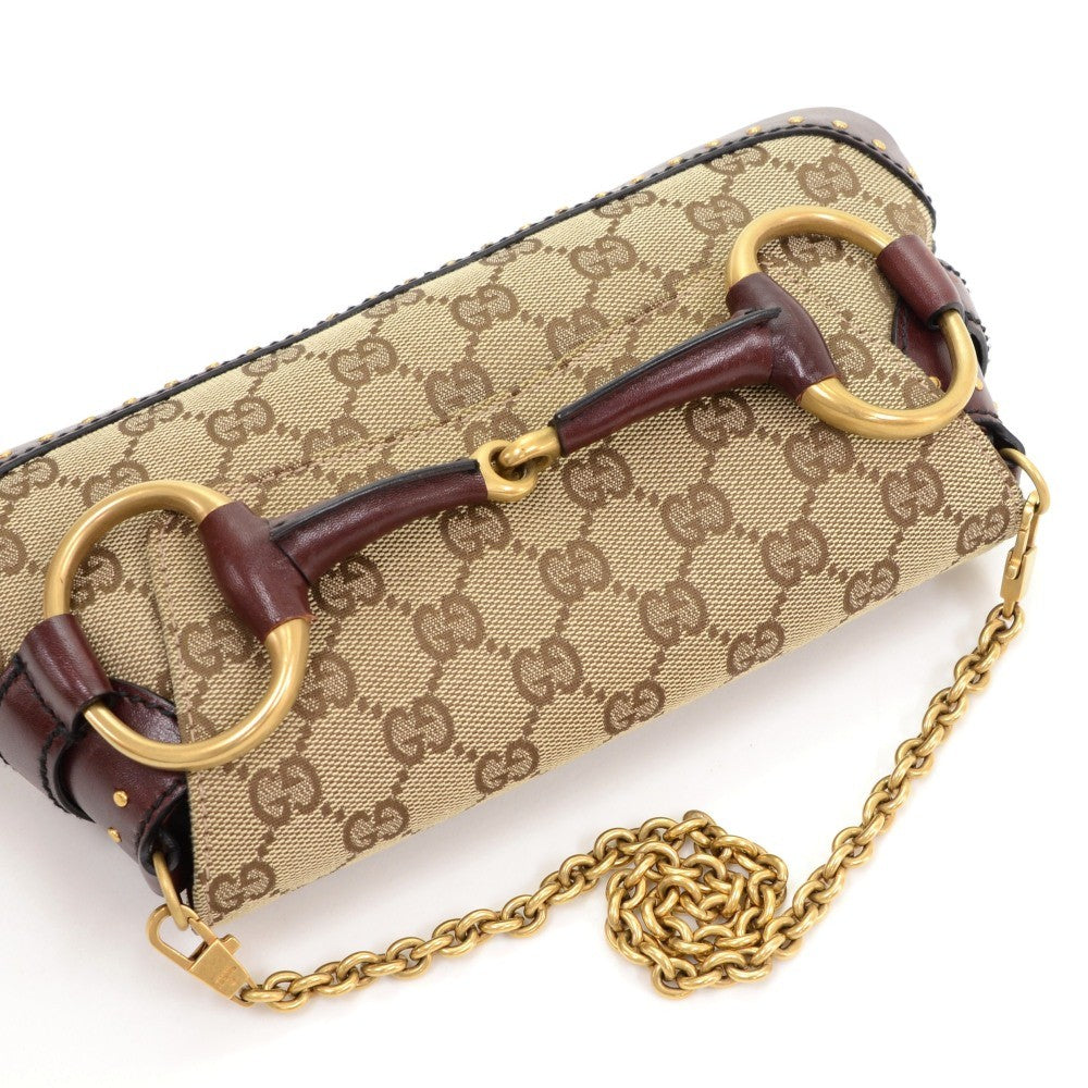 monogram canvas horsebit clutch bag