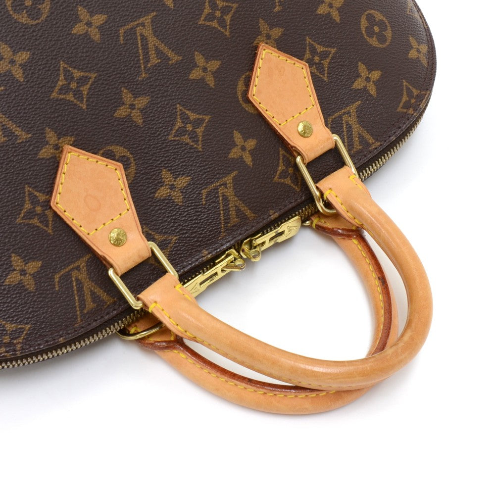 alma monogram canvas handbag with strap
