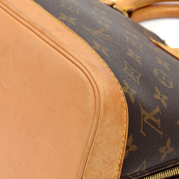 alma monogram canvas handbag with strap