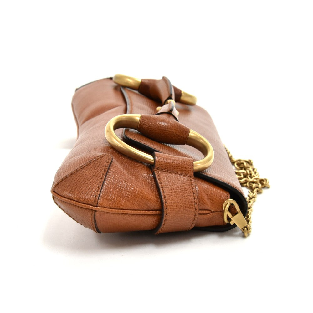 textured leather horsebit evening bag