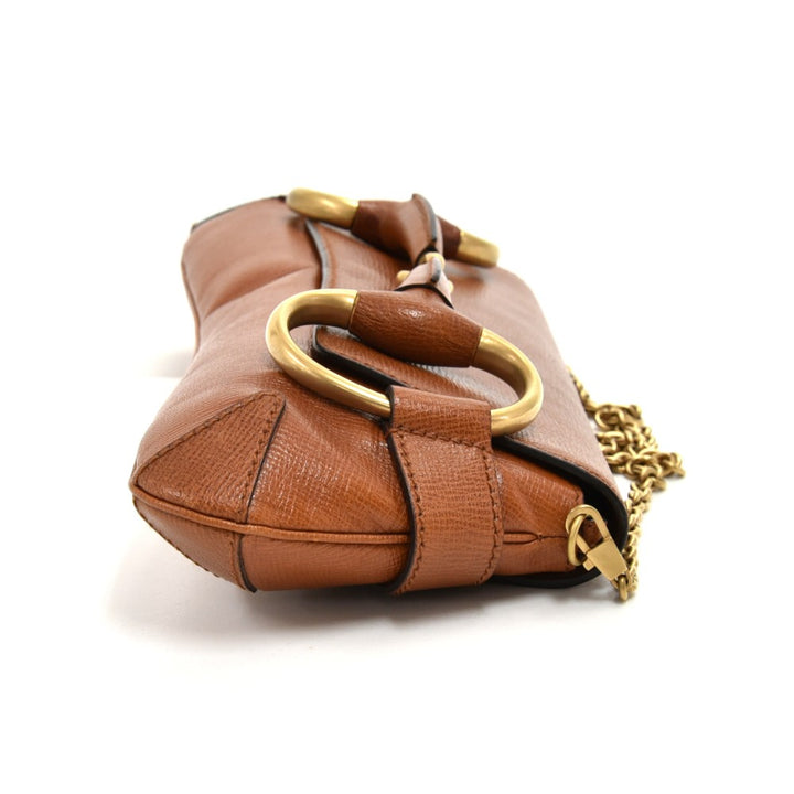 textured leather horsebit evening bag