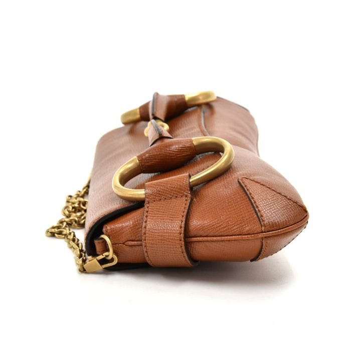 textured leather horsebit evening bag