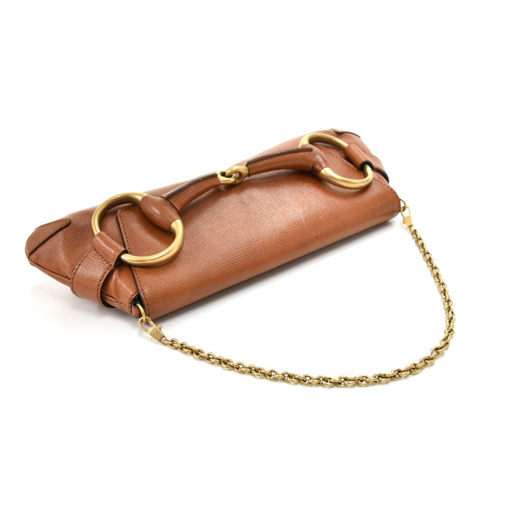 textured leather horsebit evening bag