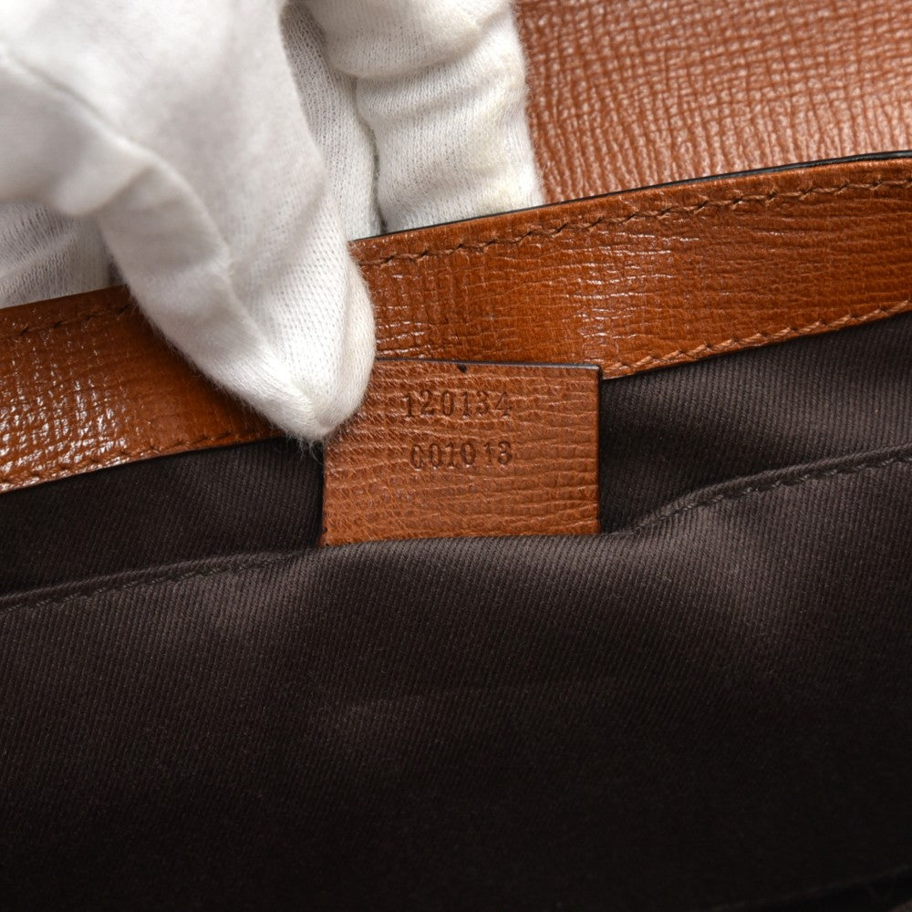 textured leather horsebit evening bag