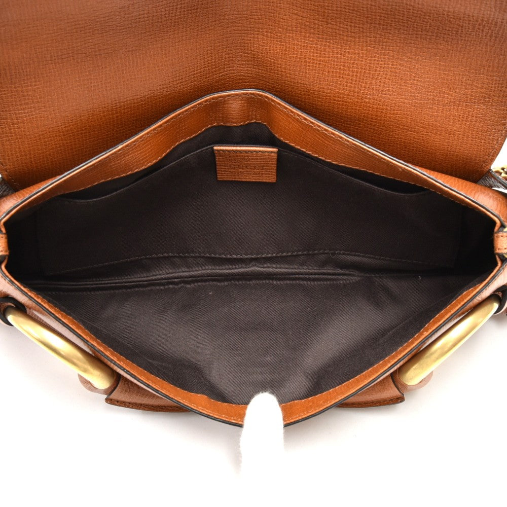 textured leather horsebit evening bag