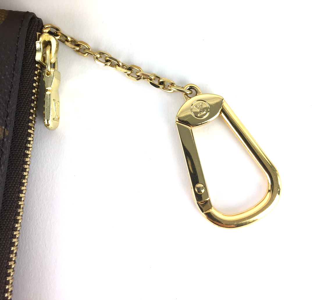 key monogram canvas pouch