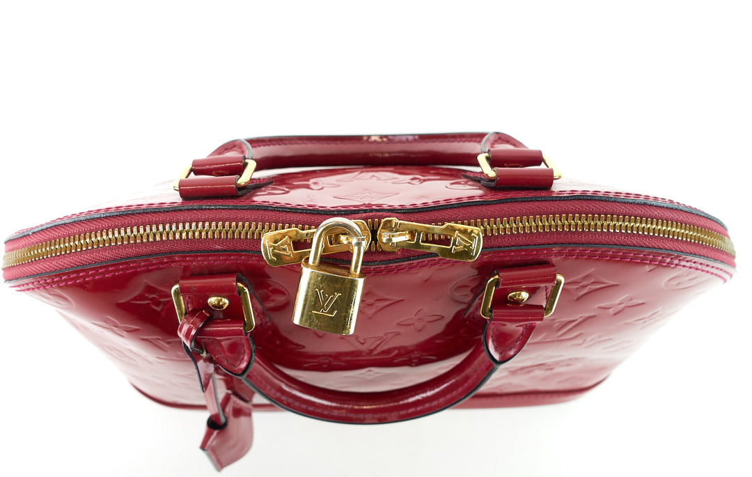 alma pm monogram vernis leather handbag