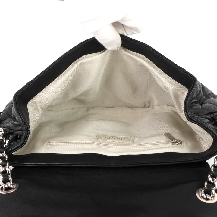 chain around large lambskin leather messenger bag