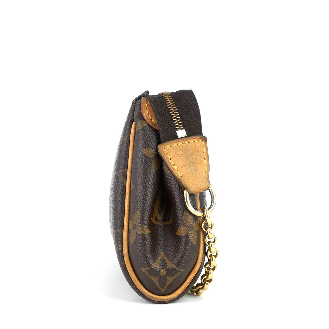 eva monogram canvas clutch bag