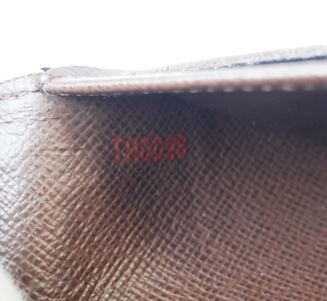 porte tresor international damier ebene canvas wallet
