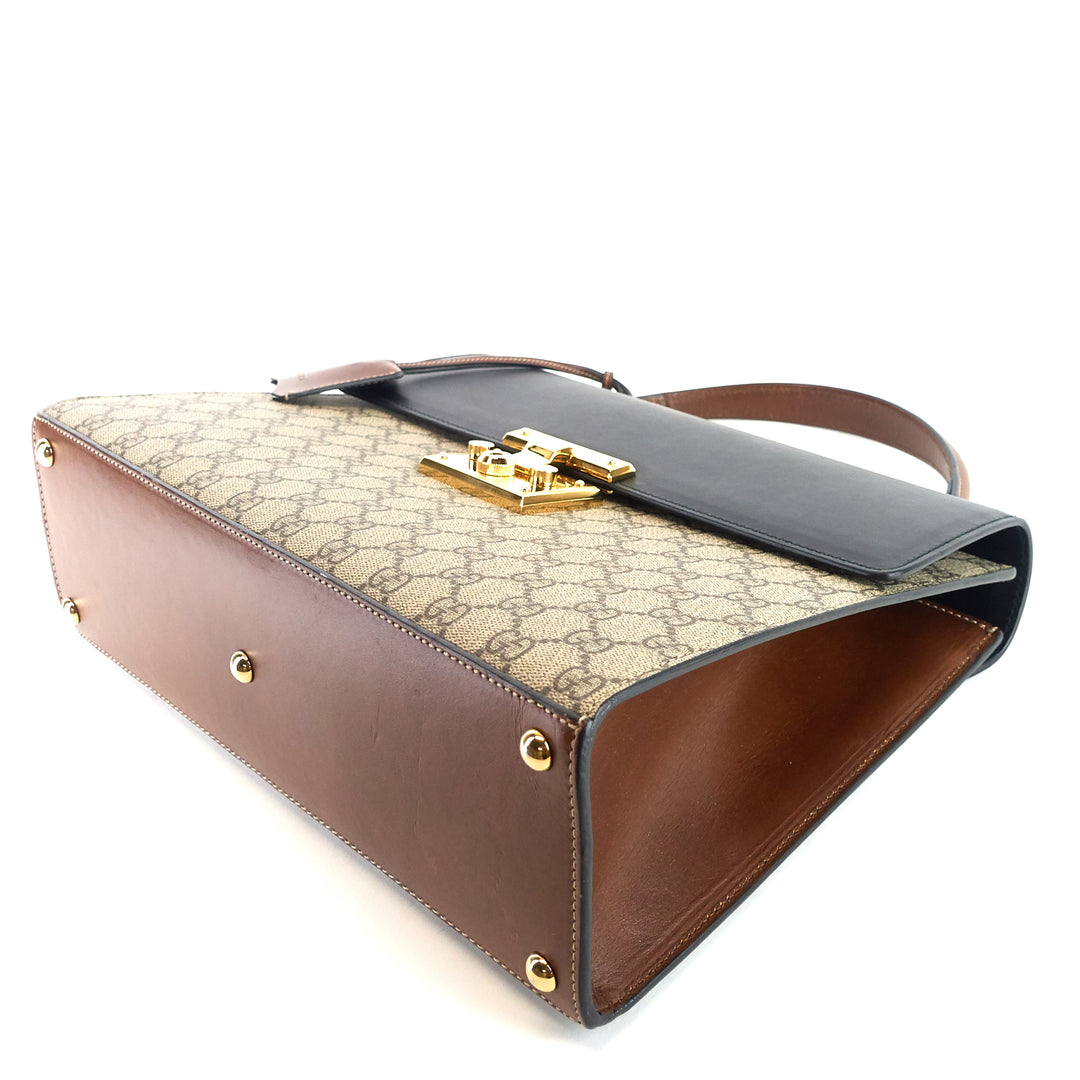 padlock supreme monogram canvas top handle medium bag