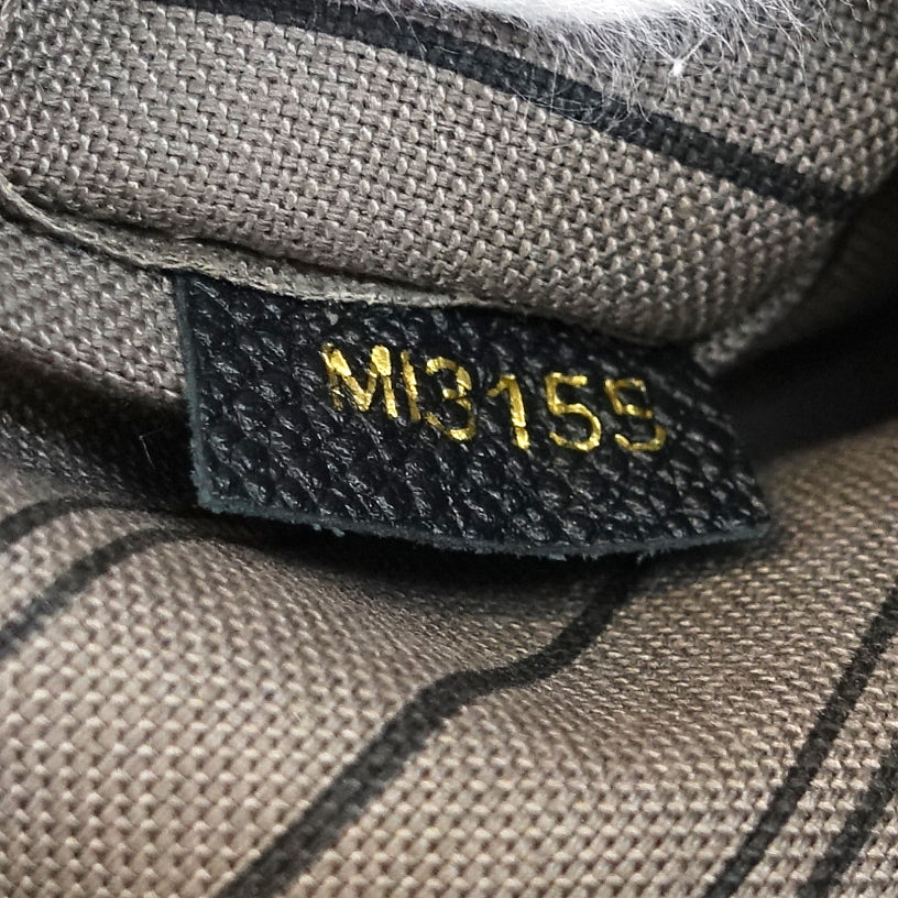 montaigne mm monogram empreinte leather bag