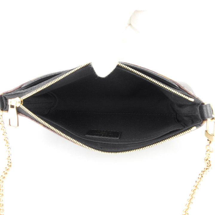 pallas monogram canvas clutch bag