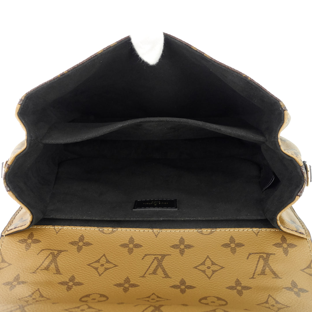 pochette metis reverse monogram canvas bag