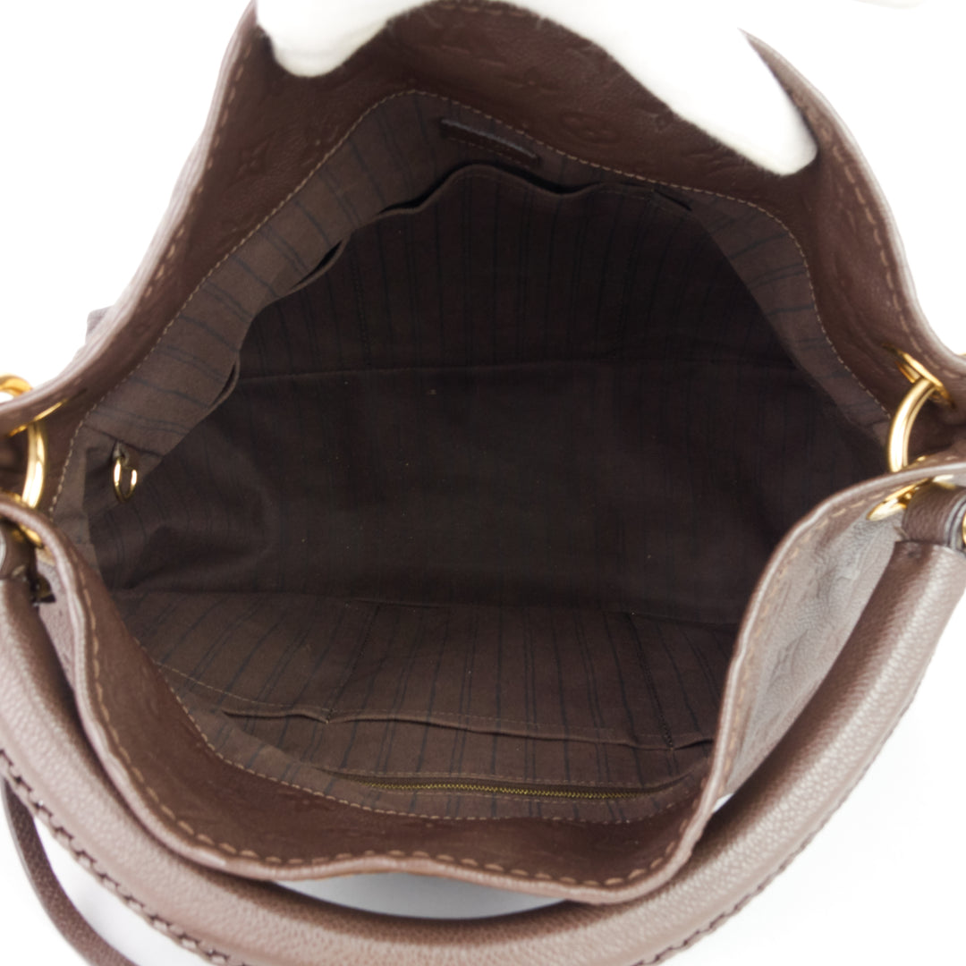 artsy mm monogram empreinte leather bag