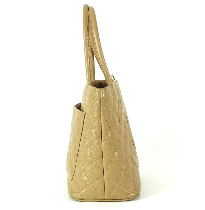 quilted caviar leather suspended medallion tote bag