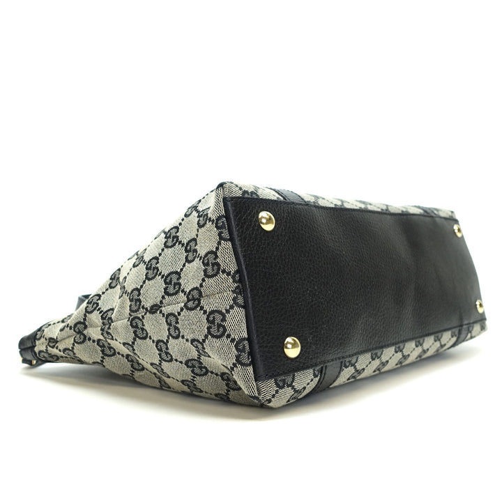 abbey monogram canvas zip tote bag