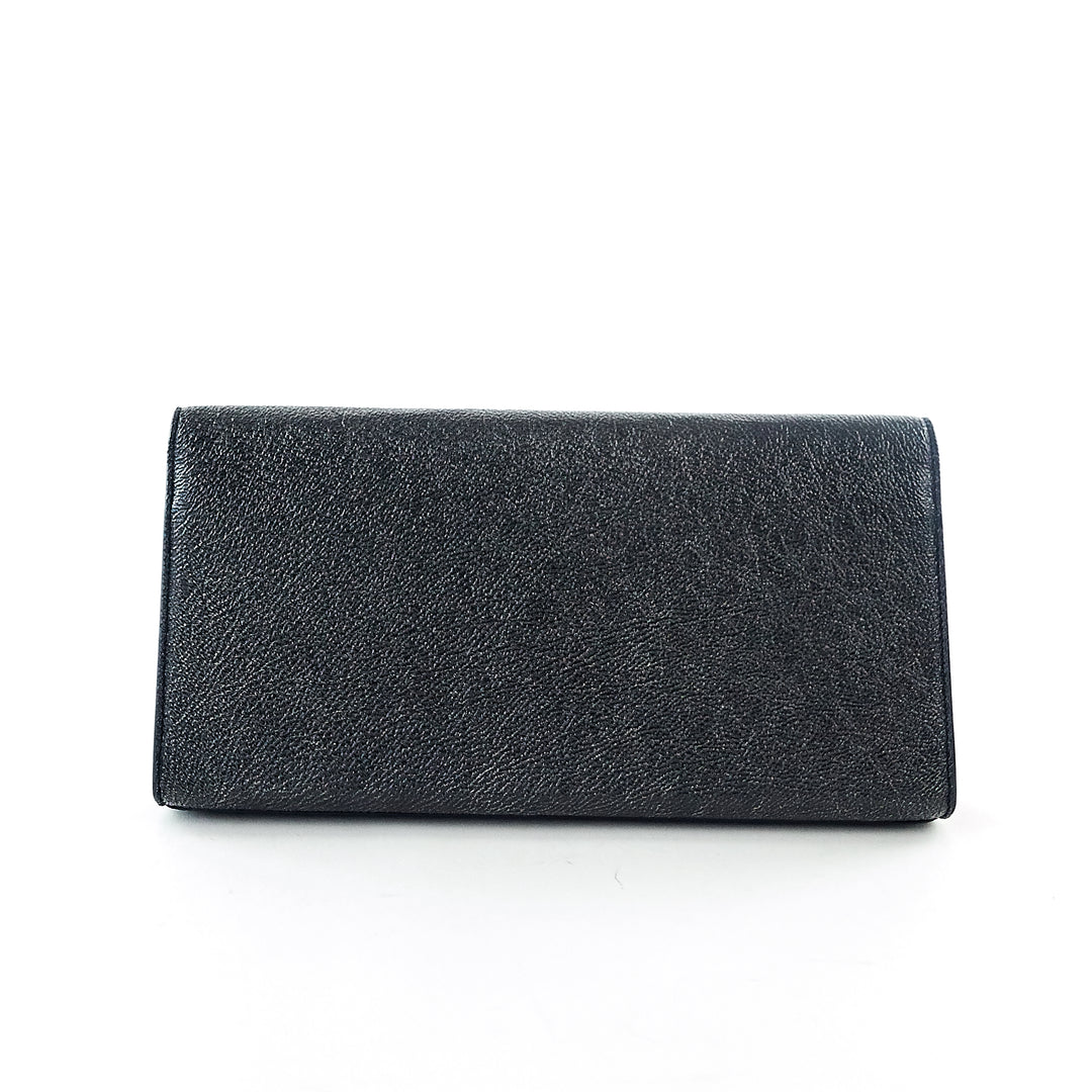 cassandre grain de poudre calf leather clutch bag